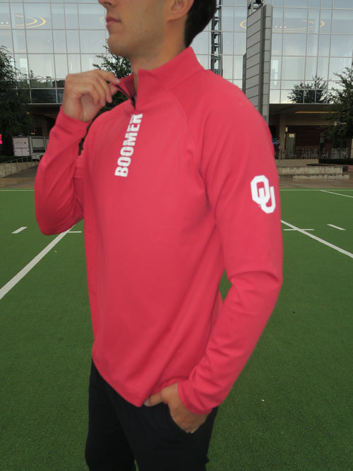 Model wearing GMDY Oklahoma Sooners crimson quarter zip with white BOOMER lettering and OU sleeve logo, side view