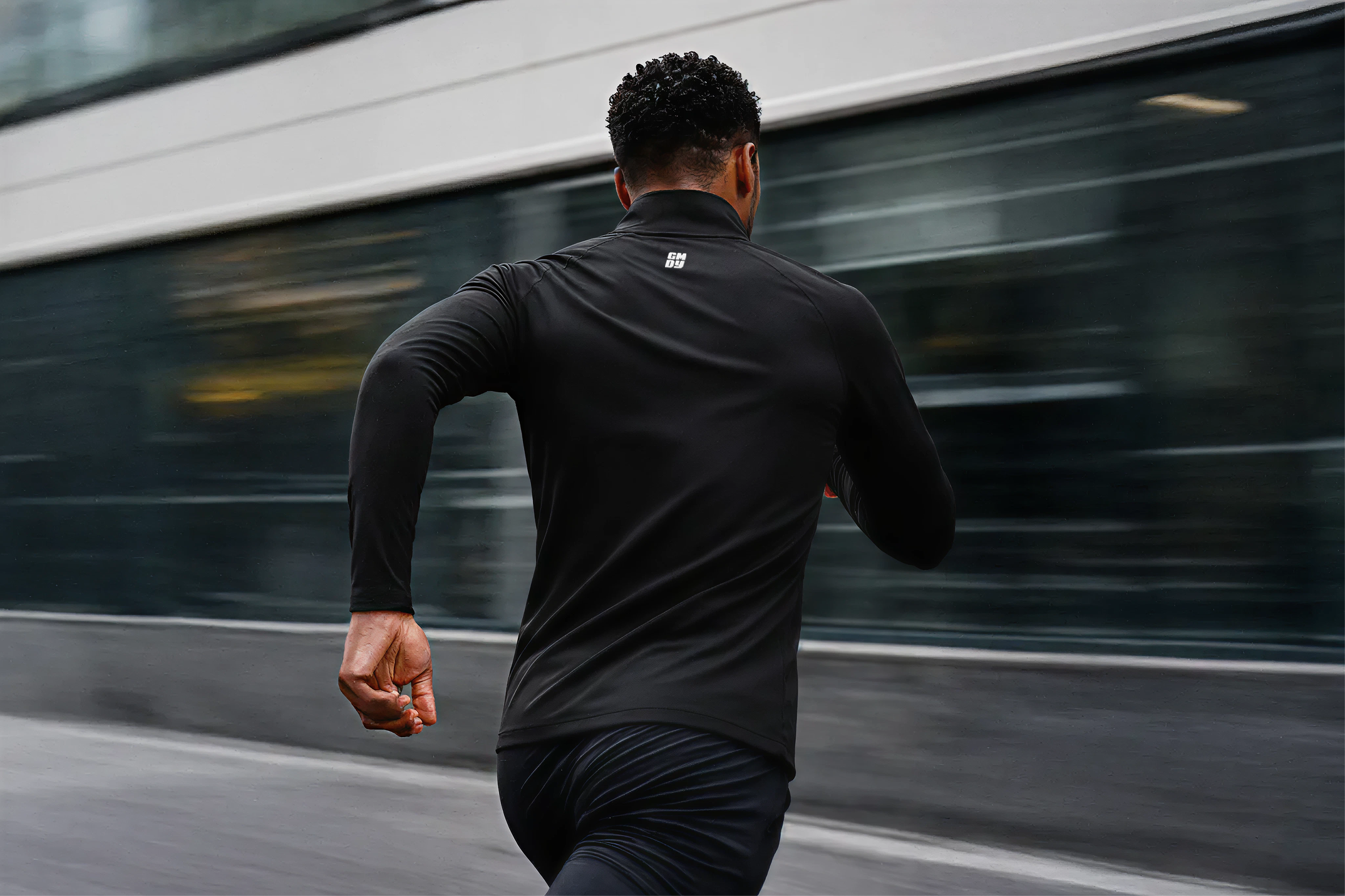 Person running on a street with a blurred background