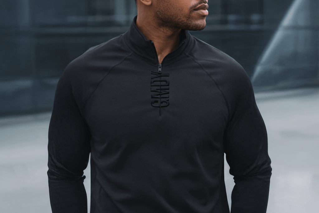 Men's black quarter zip pullover lifestyle photo - GMDY premium everyday menswear styled casually